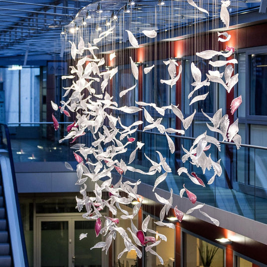 Flying Glass Feather Chandelier suspended through a multi-level atrium