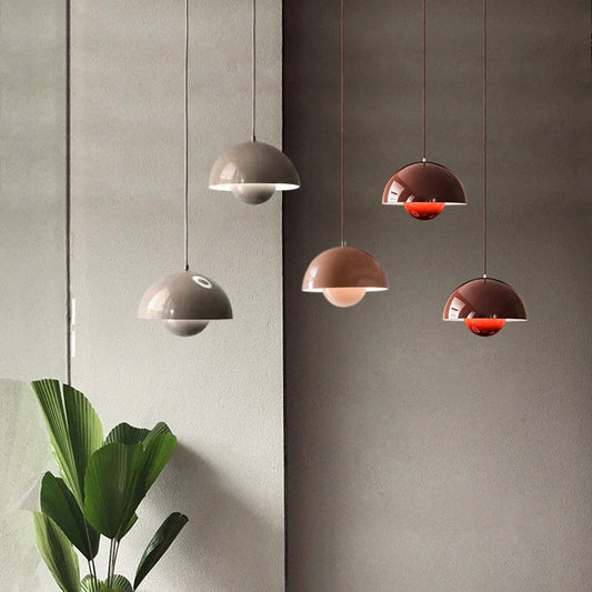 multiple Flowerpot pendant lights arranged over a kitchen island