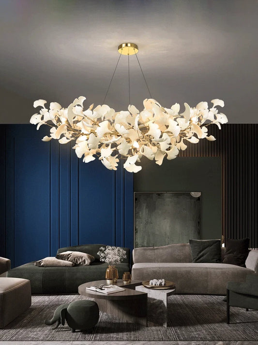 Large white ceramic ginkgo chandelier in a dark blue living room