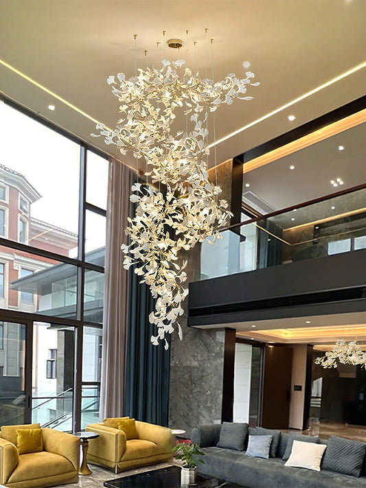 Tall cascading Ginkgo Chandelier F in a double-height living space with upper gallery