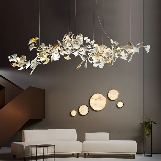 Long Ginkgo Chandelier Wave spanning a modern living room seating area