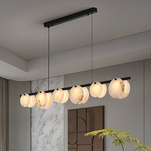 Lunar Glow Alabaster Chandelier with visibly varied discs in a neutral interior