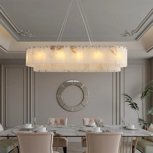 Nordic Long Alabaster Chandelier above a marble dining table in a paneled room
