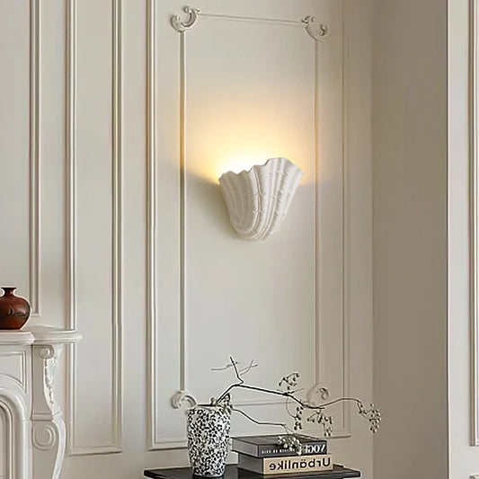 Sculptural Shell Plaster Wall Lamp above a styled console