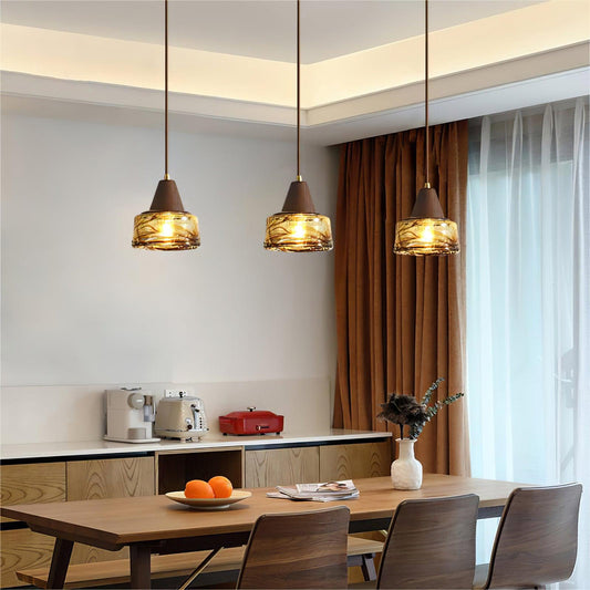 Three Vintage Murano Pendant Lamps above a light wood kitchen island and dining table