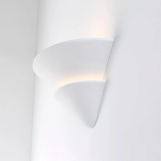 Side view of a white Wave Plaster Wall Lamp showing its matte surface